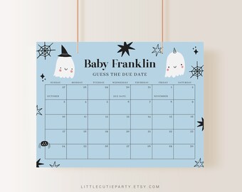 May include: A pale blue baby shower calendar with the text "Baby Franklin Guess the Due Date." The calendar grid displays October and November dates, and is decorated with ghost and spiderweb illustrations.