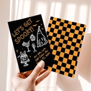 May include: A rectangular Halloween party invitation card with a black background and orange text reading LET'S GET SPOOKY, featuring white line drawings of a ghost, cake, and skeleton hand. The reverse side has an orange and black checkerboard pattern.