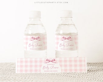 May include: Pink and white gingham baby shower water bottle labels with a pink bow and the text "Jennifer's Baby Shower Thanks for Coming".