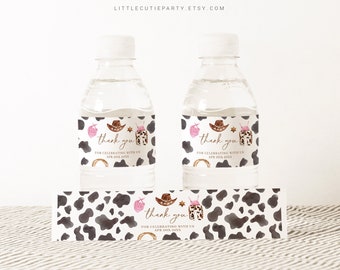 May include: Water bottle labels with a cow print background and a pink and brown cowboy hat design. The labels say "thank you for celebrating with us" and include a date.