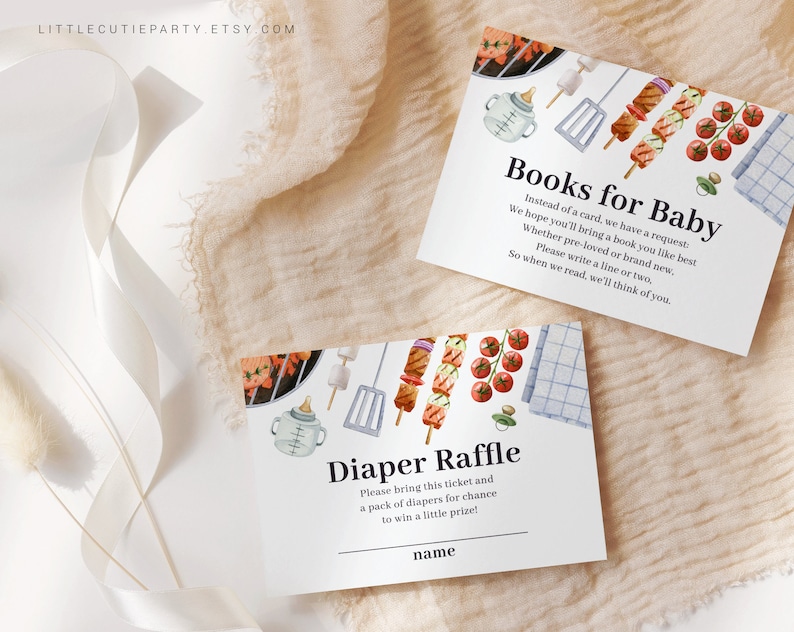 May include: Two white cards with blue text and watercolor illustrations of a grill, skewers, and a baby bottle. The top card says "Books for Baby" and asks guests to bring a book for the baby. The bottom card says "Diaper Raffle" and asks guests to bring a pack of diapers for a chance to win a prize.