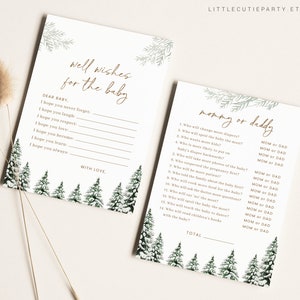 May include: Two baby shower game cards with a winter forest theme. One card reads "Well Wishes for the Baby" and the other reads "Mommy or Daddy". Both cards have a white background with green and gold accents.