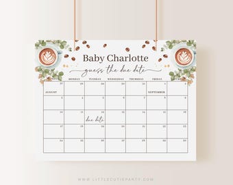 May include: A calendar with the text "Baby Charlotte guess the due date" and a calendar grid. The calendar features coffee cup illustrations and coffee beans. The words "due date" are handwritten on the 12th of the month.