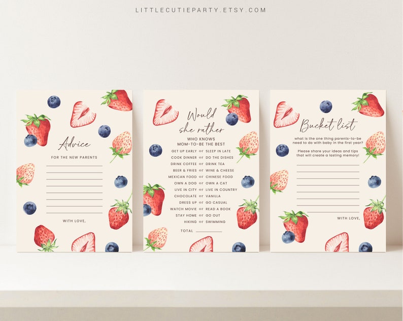 May include: Three printable baby shower game cards with a watercolor strawberry and blueberry design. The cards are titled "Advice for the New Parents", "Would She Rather", and "Bucket List".