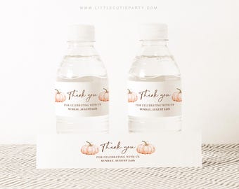 May include: Two clear water bottles with white caps, each featuring a label with the text "Thank you" and a pumpkin illustration. The label also includes the text "For celebrating with us Sunday, August 24th". A matching card is below the bottles.