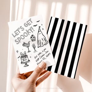 May include: A white rectangular Halloween party invitation card featuring black line art of a ghost, a cupcake, a skeleton hand, and a cake with the text 'LET'S GET SPOOKY!' and event details. The reverse side has a black and white vertical stripe pattern.