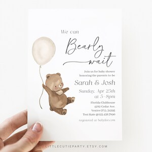 May include: A baby shower invitation with a watercolor illustration of a brown bear holding a white balloon. The text reads "We can Bearly wait" and includes the names "Sarah & Josh" and the date "Sunday, Apr 25th".