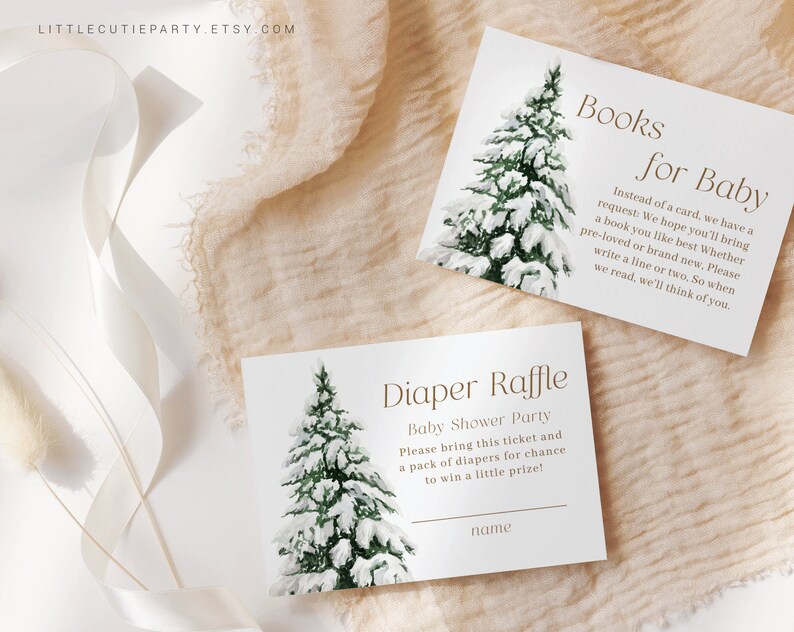 May include: Two white cards with a watercolor illustration of a snow-covered evergreen tree. One card reads "Books for Baby" and the other says "Diaper Raffle" for a baby shower. The Etsy shop name is in the top left corner.