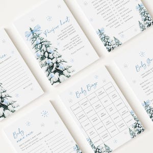May include: A collection of baby shower game cards on a white background. Each card features a watercolor illustration of a snow-covered Christmas tree with blue accents. Games include "Pacifier Hunt," "Baby Bingo," and "Baby Guess."