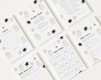Könnte beinhalten: Eine Sammlung weißer Babyparty-Spielkarten mit Halloween-Motiv. Jede Karte zeigt eine niedliche Geisterillustration, schwarze Sterne und verschiedene Spieltitel wie "Baby Bingo" und "Pacifier Hunt". Die Karten sind für eine Babyparty.