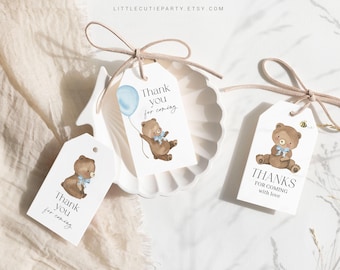 May include: Three white gift tags with brown teddy bear illustrations and blue accents. The tags say "Thank you for coming" and "Thanks for coming with love".