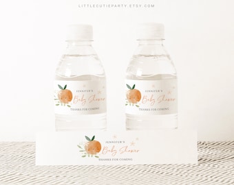 May include: Water bottle labels with a watercolor orange design. The labels say "Jennifer's Baby Shower" and "Thanks for coming".