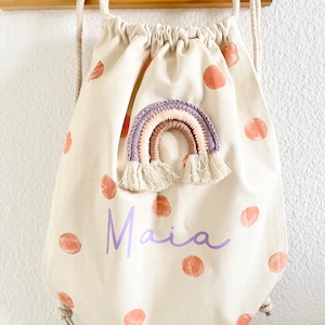 Turnbeutel bunt Stoffbeutel Stoffrucksack Regenbogen fairtrade Mädchen gepunktet personalisierbar Namen happy Flieder lila Apricot Schulkind