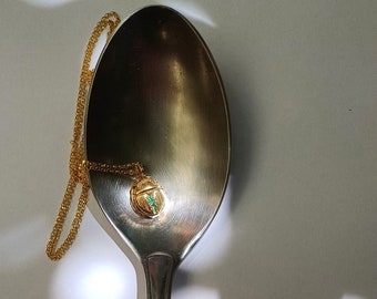 Small Egyptian scarab pendant, green zircon stones
