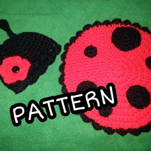 May include: Crochet pattern for a ladybug with black and red yarn. The pattern includes instructions for making a ladybug head and body.
