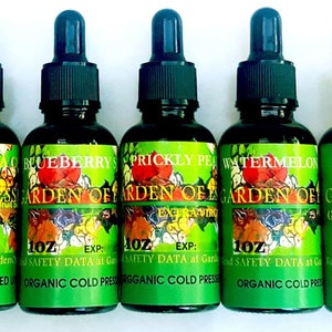 May include: Five 1 oz bottles of organic cold-pressed oil. The bottles are labeled with different fruit names: Maracuja, Blueberry, Prickly Pear, Watermelon, and Cranberry. Each bottle has a dropper top.
