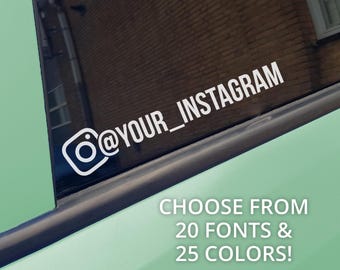 May include: A white vinyl decal featuring the Instagram camera icon and the text @YOUR_INSTAGRAM applied to a dark car window. The text CHOOSE FROM 20 FONTS & 25 COLORS! is displayed in white lettering against the light green car body panel.