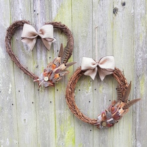 large wicker wreath with pheasant, partridge and guiuneafowl feathers