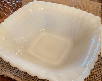 May include: A white milk glass square baking dish with a scalloped edge.