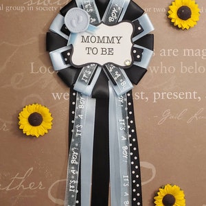 It's a boy shower corsage, mommy to be, corsage pin, party theme blue and black image 1