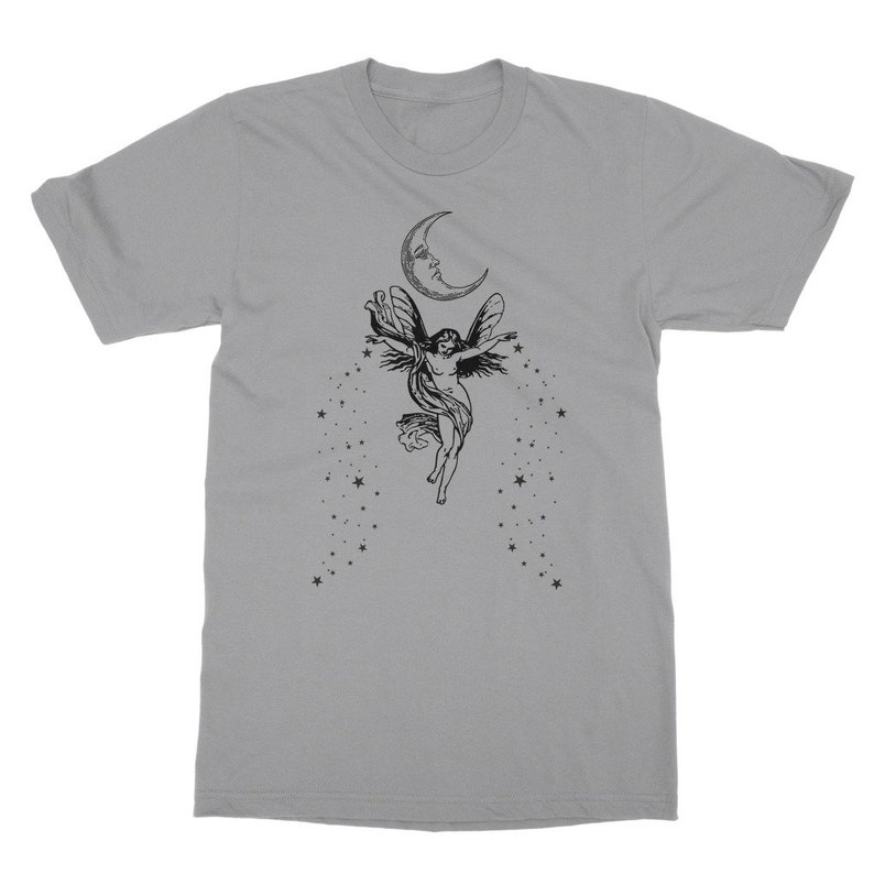 May include: A gray t-shirt with a black and white illustration of a fairy flying with wings outstretched under a crescent moon with stars.
