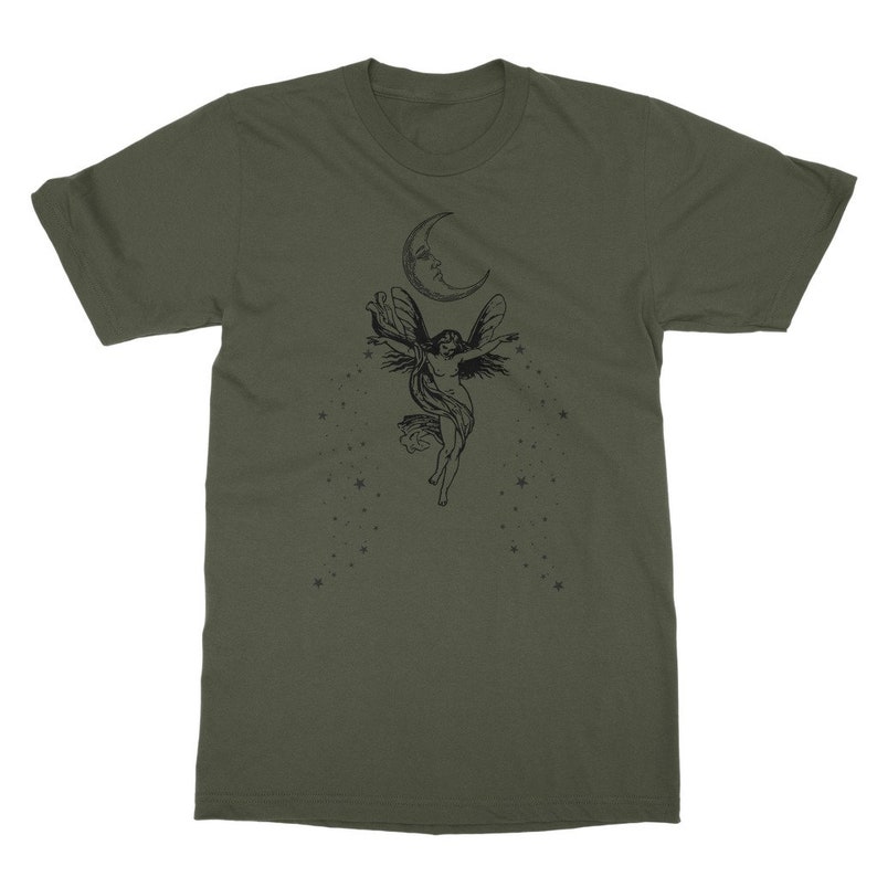 May include: A green t-shirt with a black and white graphic of a fairy flying with wings outstretched under a crescent moon with stars.