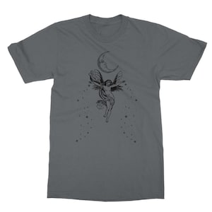 May include: A dark gray t-shirt with a black and white illustration of a fairy flying with wings outstretched. The fairy is surrounded by stars and a crescent moon.