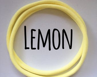 Nylon Headbands UK - Lemon Dainties. Approx 5mm wide soft and stretchy one size fits all headbands, pastel yellow skinnyelastic replacement