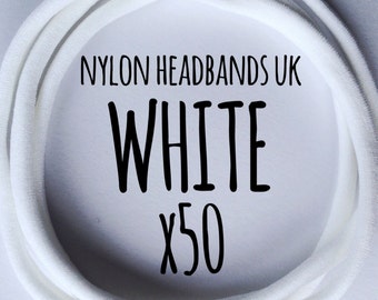 50 Nylon Headbands - White. Dainties. UK made, official Dainties. Skinny, thin, super soft. One size fits all, newborn, baby, adult hair