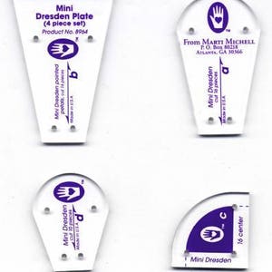 May include: A set of four clear acrylic quilting templates labeled Mini Dresden Plate 4 piece set. Each piece features purple printed text, including From Marti Michell, Product No. 8964, and specific cutting instructions for petals and centers.