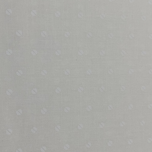 May include: A close-up of a light gray fabric with a subtle texture. The fabric has a repeating pattern of small, white, oval-shaped designs evenly spaced across the surface. The overall appearance is clean and minimalist.