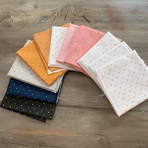 May include: A white ceramic mug with a black handle and the text "But First, Coffee" in a handwritten style. The mug is on a white surface. The mug is likely for hot beverages.