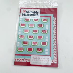 May include: A quilting pattern for a watermelon patchwork quilt. The pattern is from Thimble Blossoms by Camille Roskelley and is numbered #286. The pattern features a cheerful watermelon quilt design.
