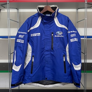 May include: A set of three ceramic mugs with a speckled, matte finish. The mugs are in shades of cream, light gray, and dark gray. Each mug has a simple, minimalist design and a rounded handle.