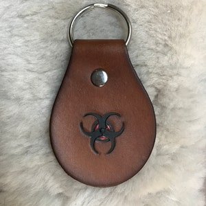 Trikru / biohazard leather key fob