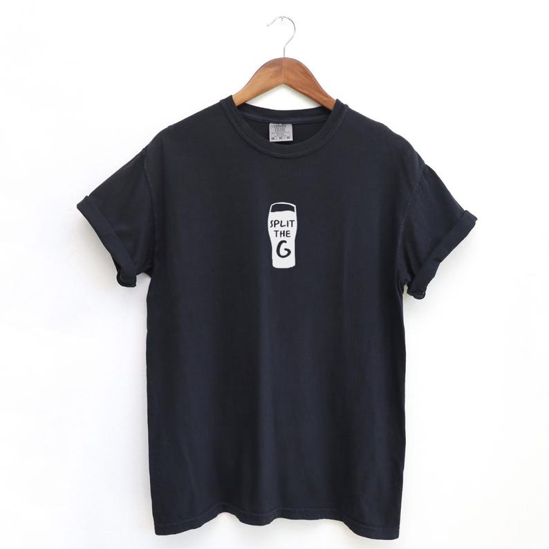 May include: Black t-shirt with a white graphic of a pint glass and the text "Split the G".