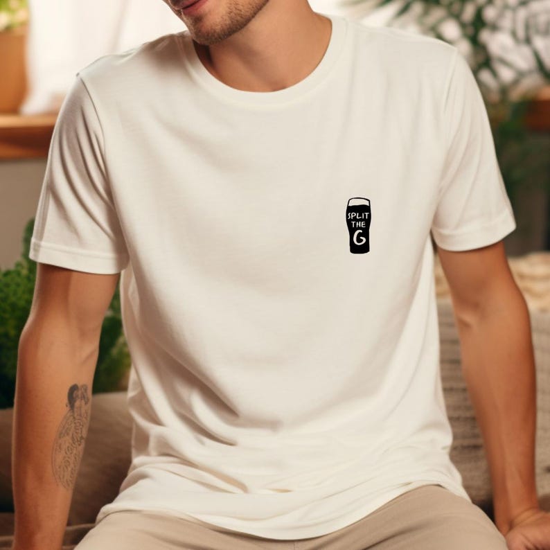 May include: White t-shirt with a black graphic of a pint glass and the text "Split the G".