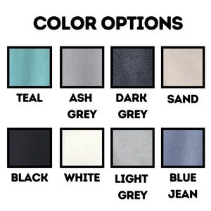 May include: Color options for a t-shirt in teal, ash grey, dark grey, sand, black, white, light grey, and blue jean.