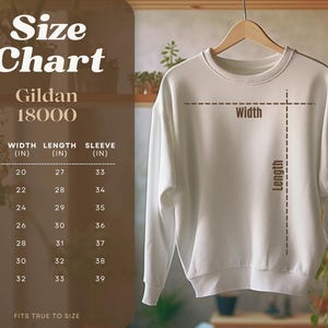 May include: Size chart for Gildan 18000 sweatshirts, showing width, length, and sleeve measurements in inches for sizes S through 4XL.  FITS TRUE TO SIZE.