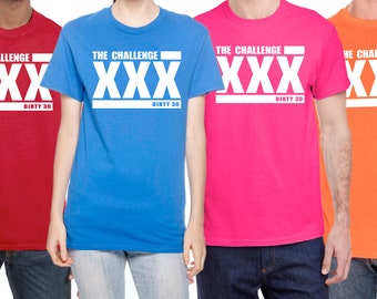 May include: Four t-shirts in different colors, red, blue, pink, and orange, with the text "THE CHALLENGE XXX DIRTY 30" printed in white on the front.