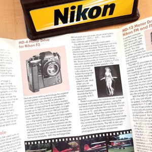 The Nikon System, Nikon Motor Drives Full Color Brochure - MD-4, MD-12 - 35mm Cameras - 1981 - Multi-page Fold Out  - Mint Condition