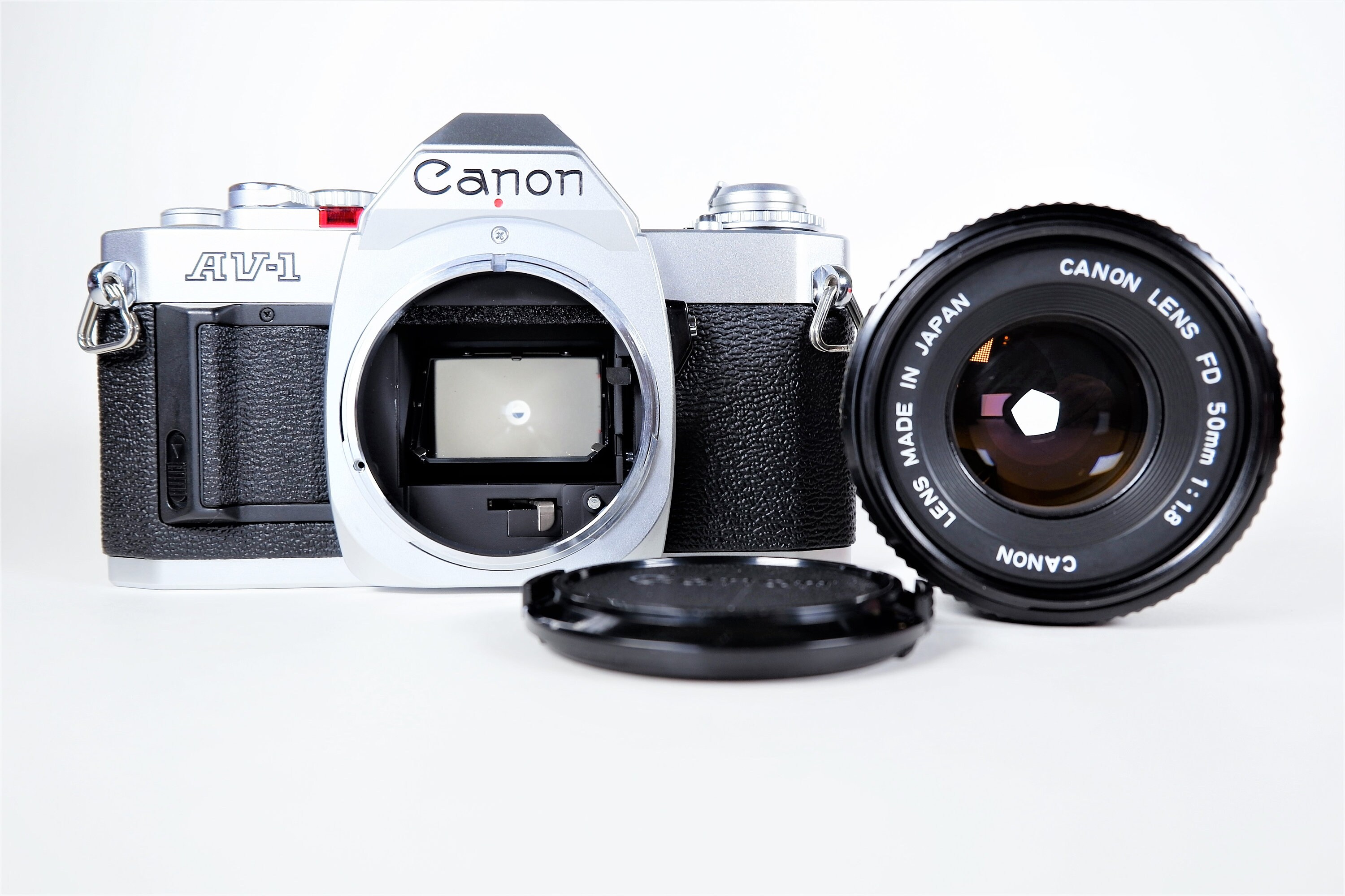 Canon AV1 35mm Single Lens Reflex (SLR) Film Camera w/ Canon NFD 50mm