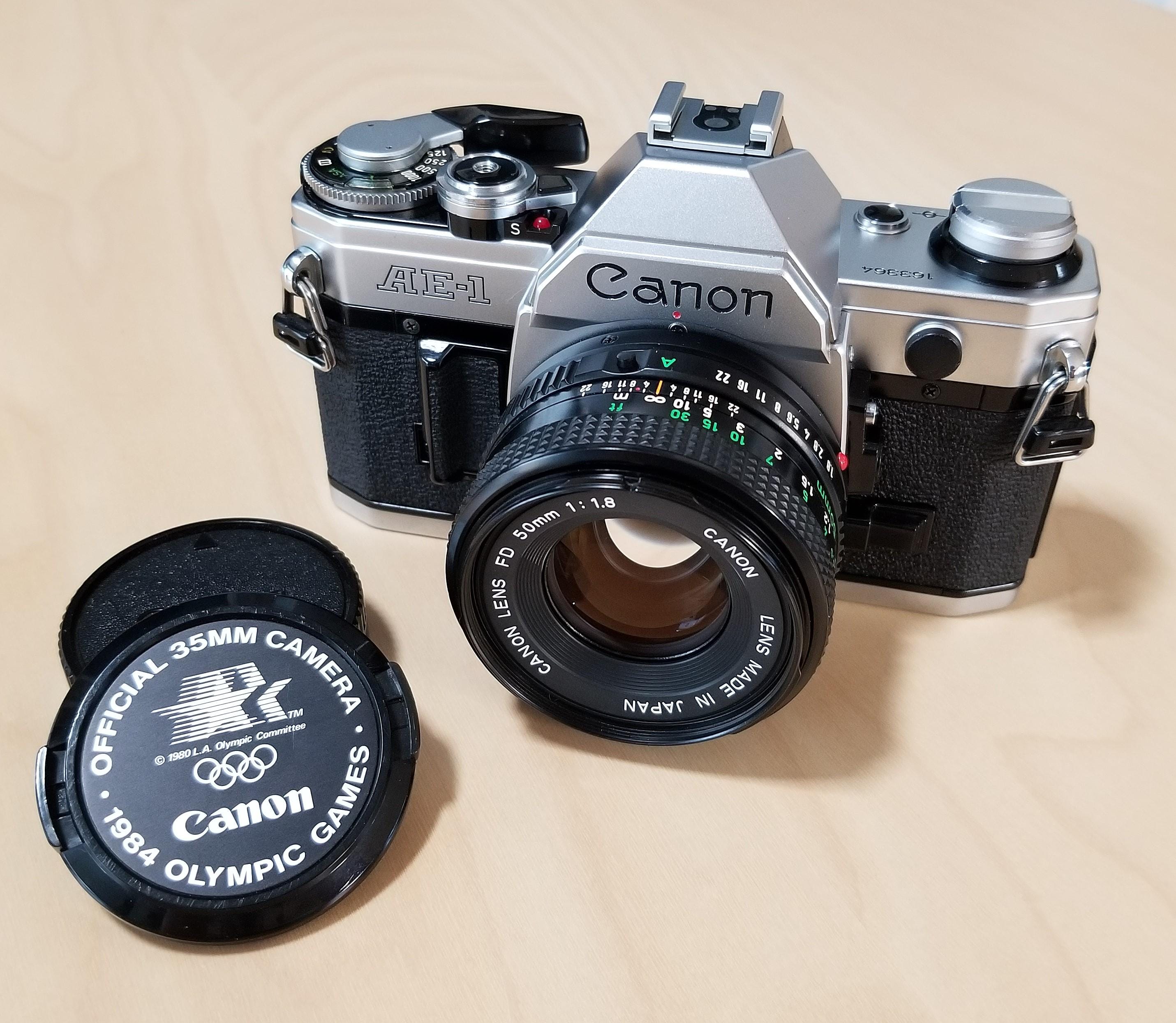 Canon AE-1 Program 1984 LAオリンピック記念ベルト付き Canon AE-1 Program 35mm Camera 1984 Olympic Games Lens Cap