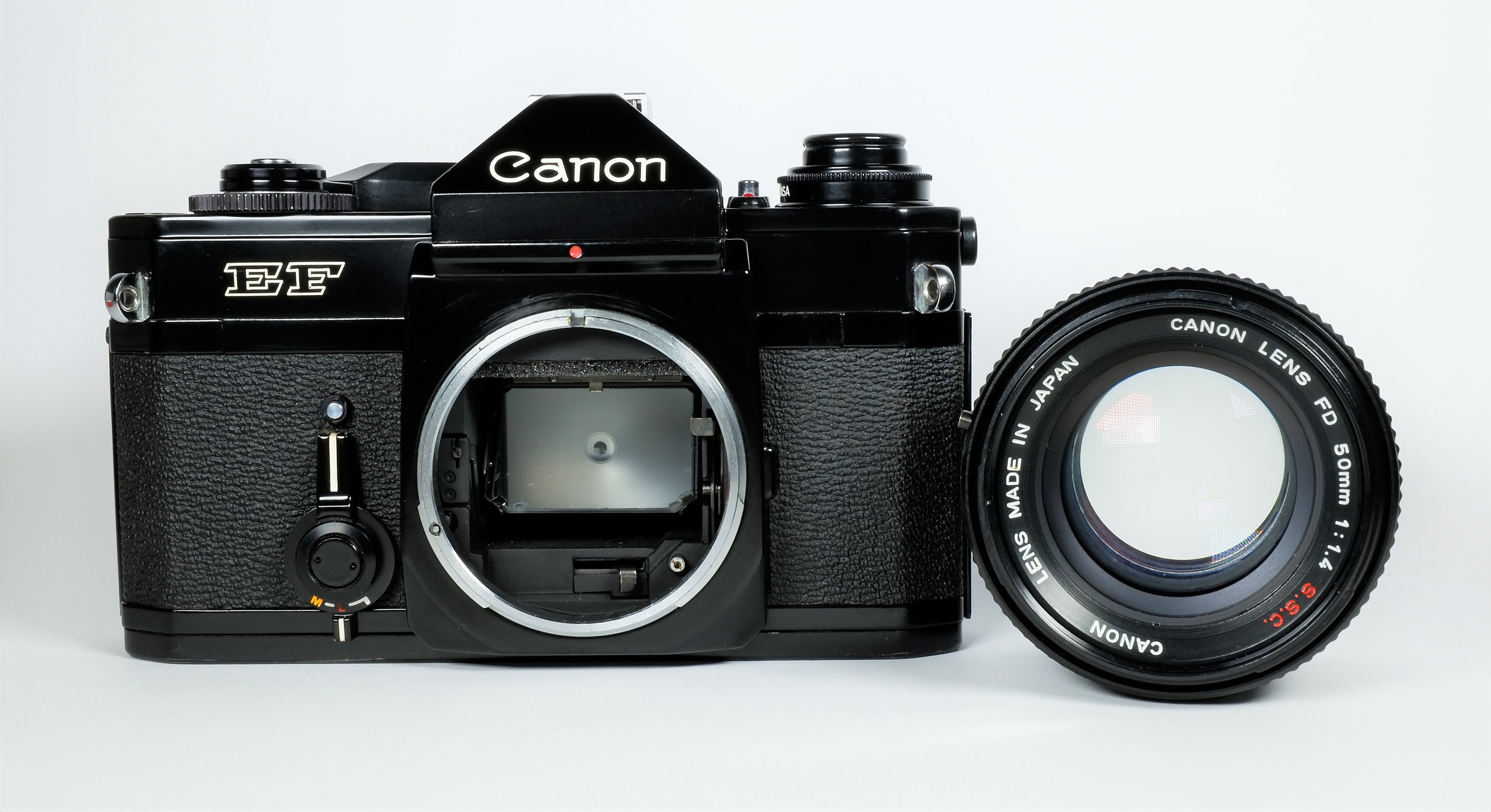  Canon  EF  35mm SLR  Film Camera with Canon  FD 50mm f 1 4 