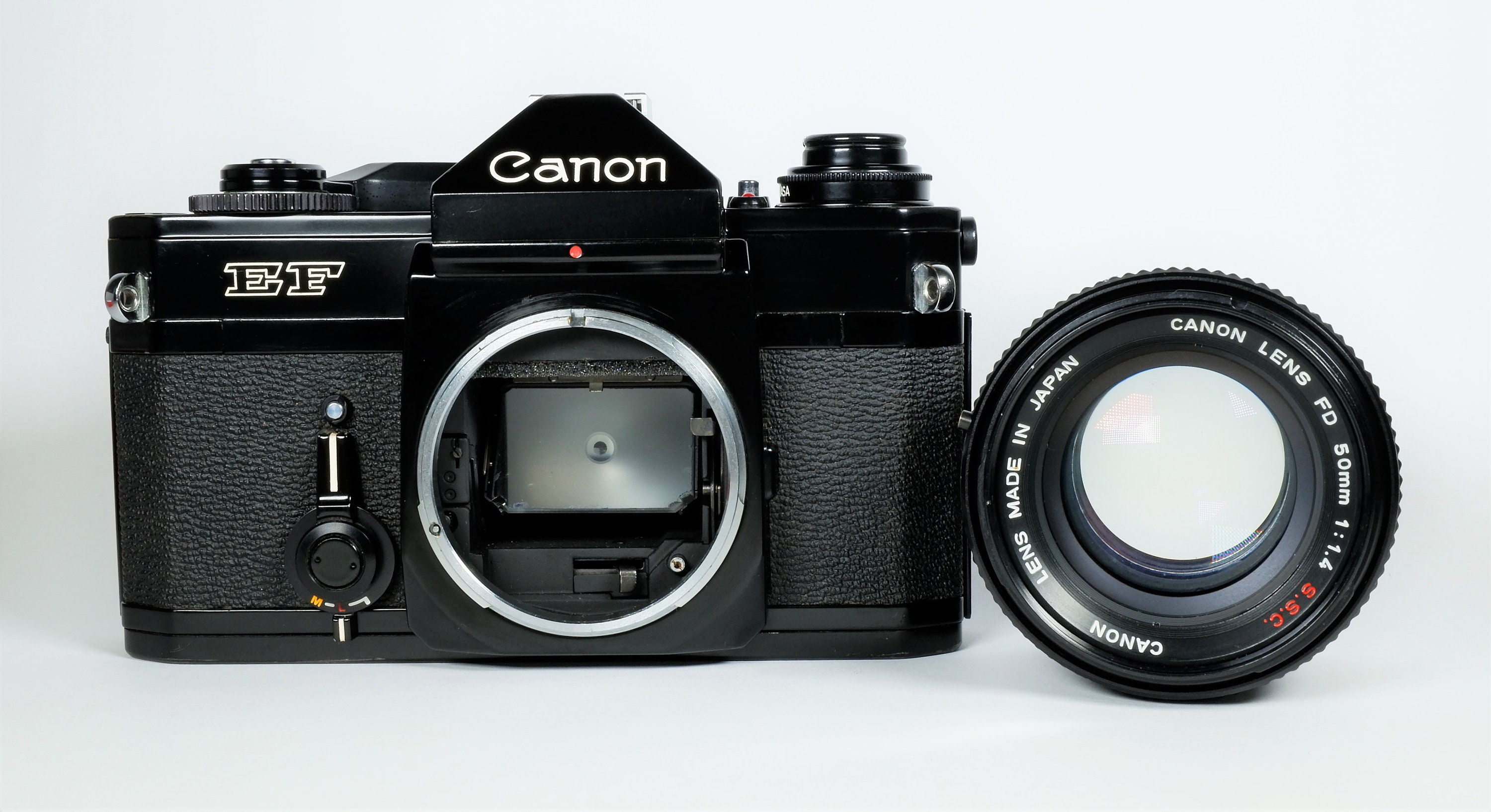  Canon  EF 35mm  SLR Film Camera  with Canon  FD 50mm f 1 4 