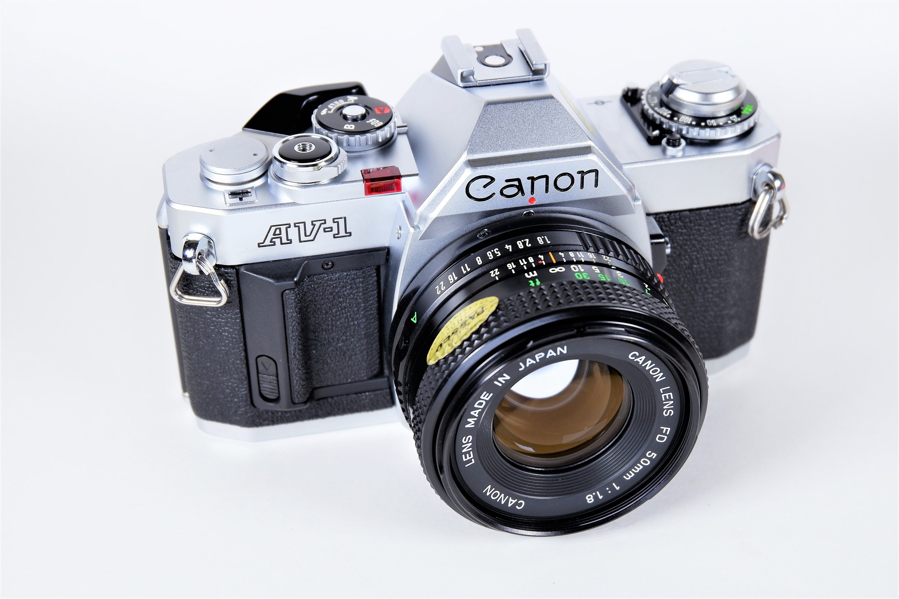 Canon AV1 35mm Single Lens Reflex (SLR) Film Camera w/ Canon NFD 50mm