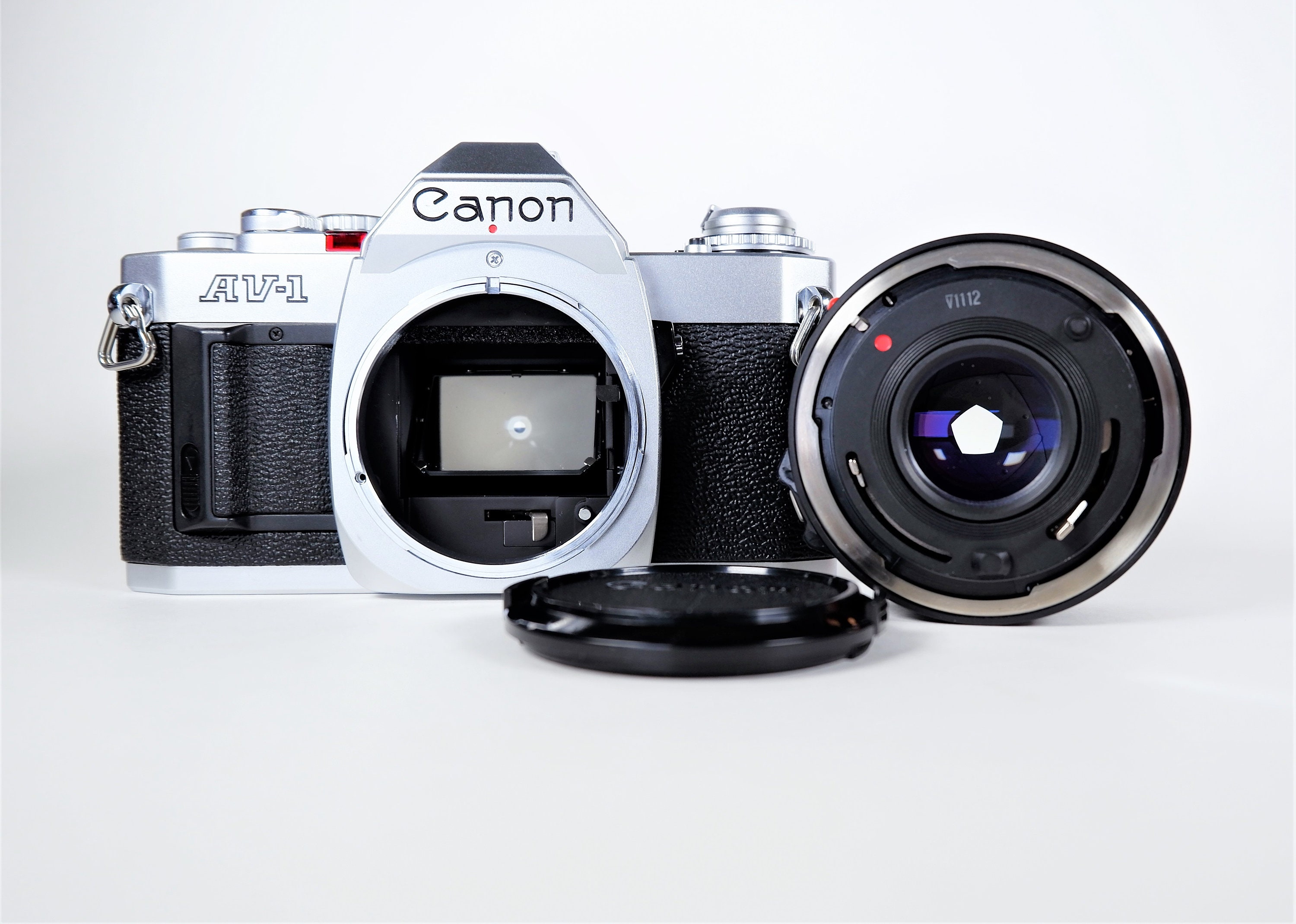 Canon AV1 35mm Single Lens Reflex (SLR) Film Camera w/ Canon NFD 50mm
