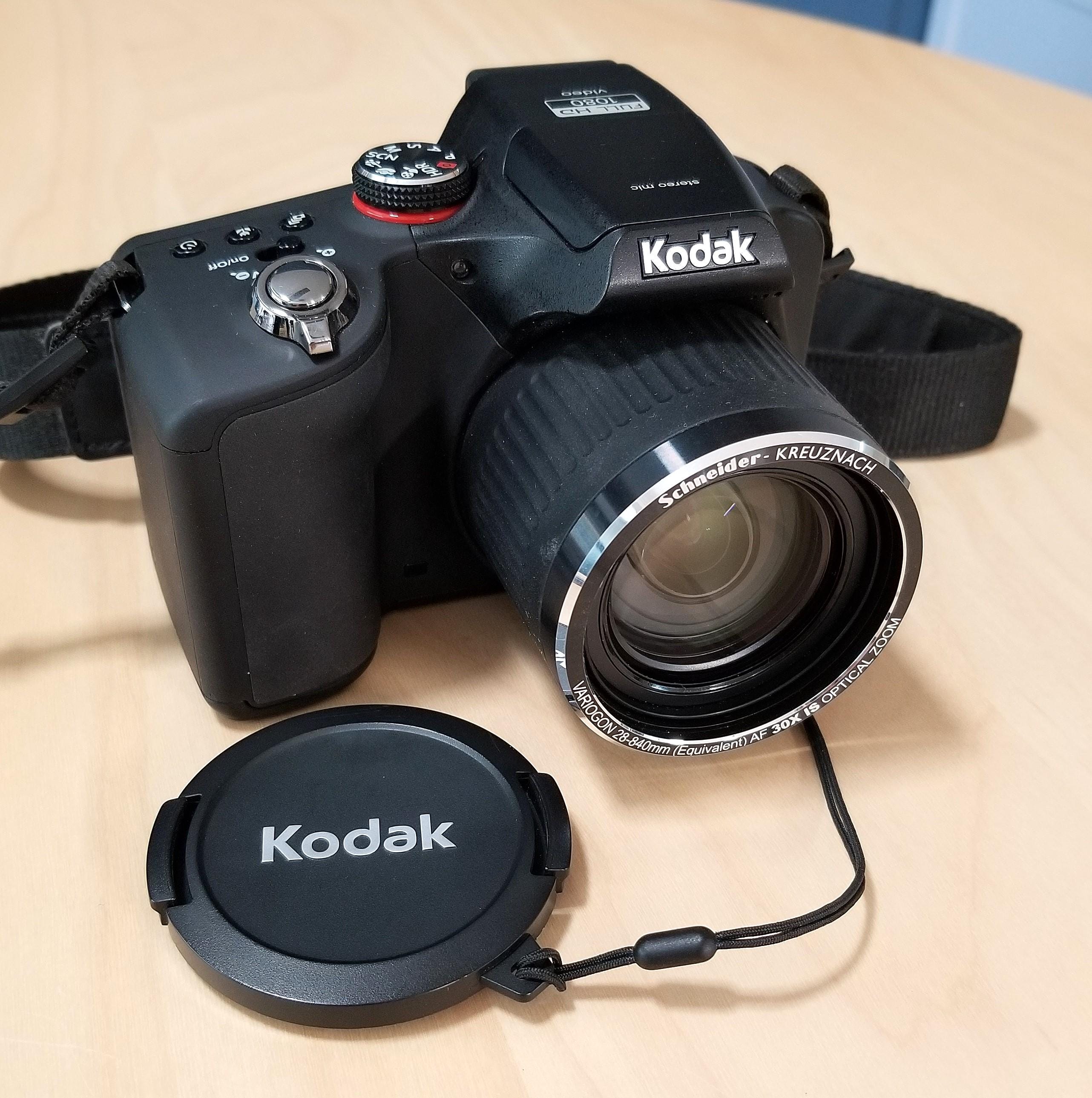 Kodak EasyShare Max Z990 IS 12MP Digital Camera w/ Schneider-Kreuznach 28-840mm Zoom Lens, Strap, Inst, Cap, Nylon Case, Charger, Batteries Kodak EasyShare Max Z990 IS 12MP Digital Camera w/ Schneider-Kreuznach 28-840mm Zoom Lens, Strap, Inst, Cap, Nylon Case, Charger, Batteries