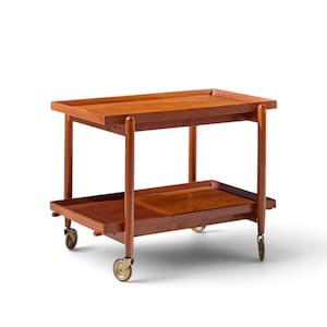 May include: A rectangular wooden serving cart featuring two tiers with raised edges. The cart is constructed from a warm-toned wood and is supported by four slender legs, each equipped with a small metal caster wheel for mobility.