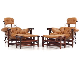 May include: Two brown leather lounge chairs with matching ottomans. The chairs have a woven rope design and are made of dark wood.